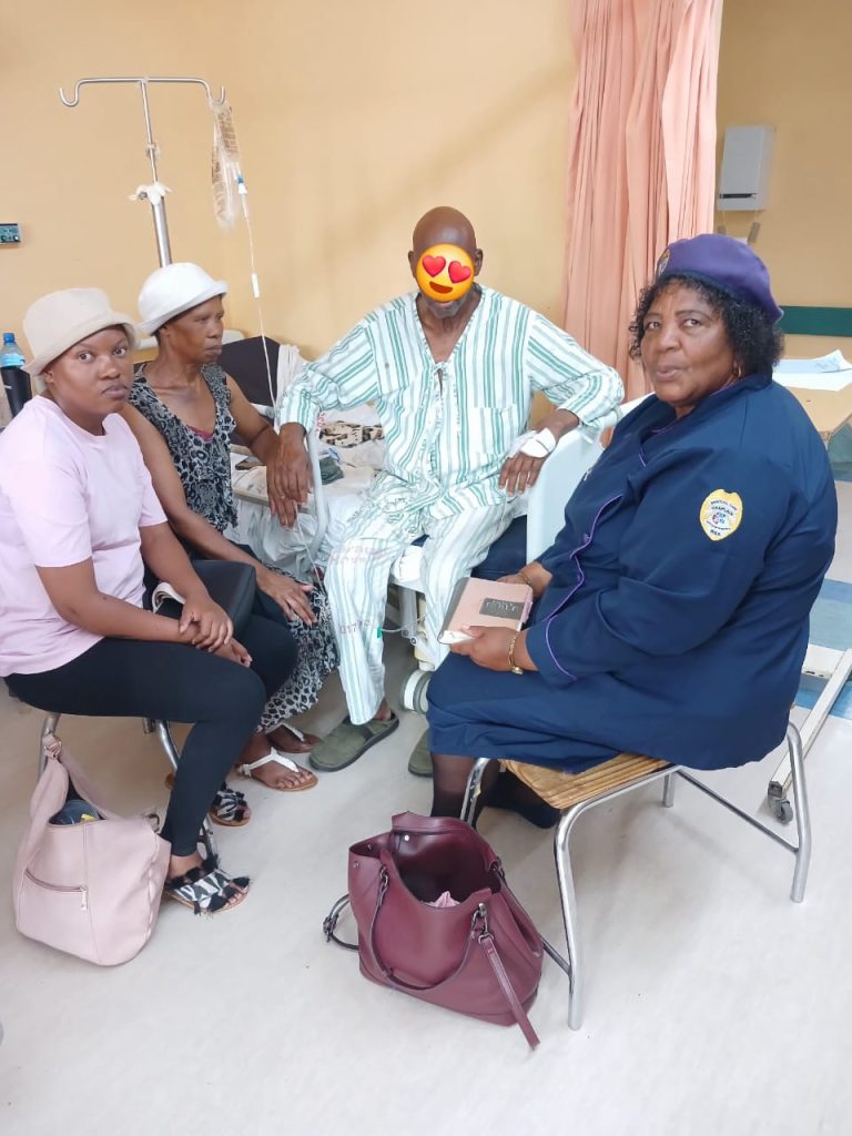 MCC chaplain visiting a patient and family in hospital